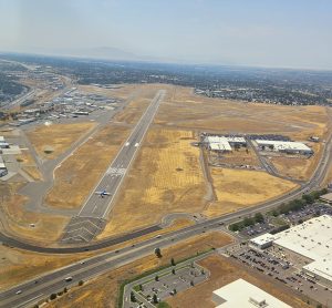 Aerial view of an airport runway during an Axiom Aviation flight – Accelerated Commercial Pilot Course