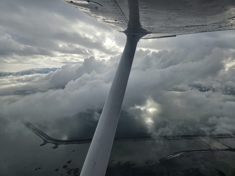View above the clouds during an Axiom Aviation training flight – How to Get an Aerial Survey Pilot Job