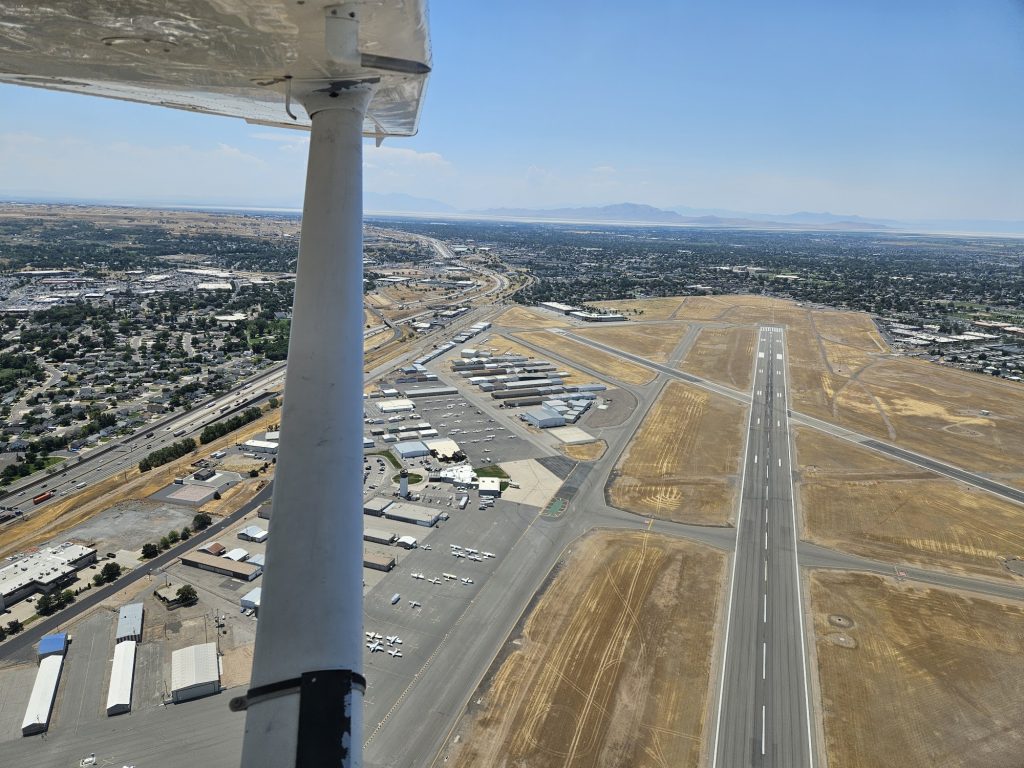 Aerial view of an airport runway during an Axiom Aviation flight – Best Student Pilot Supplies
