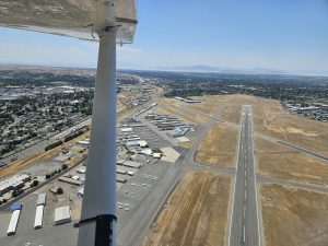 Aerial view of an airport runway during an Axiom Aviation flight – Best Airline Pilot Pathway Programs