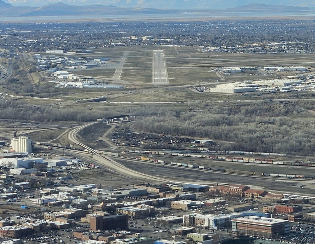 Aerial view of an airport runway during an Axiom Aviation flight – Best Airline Pilot Interview Questions to Practice