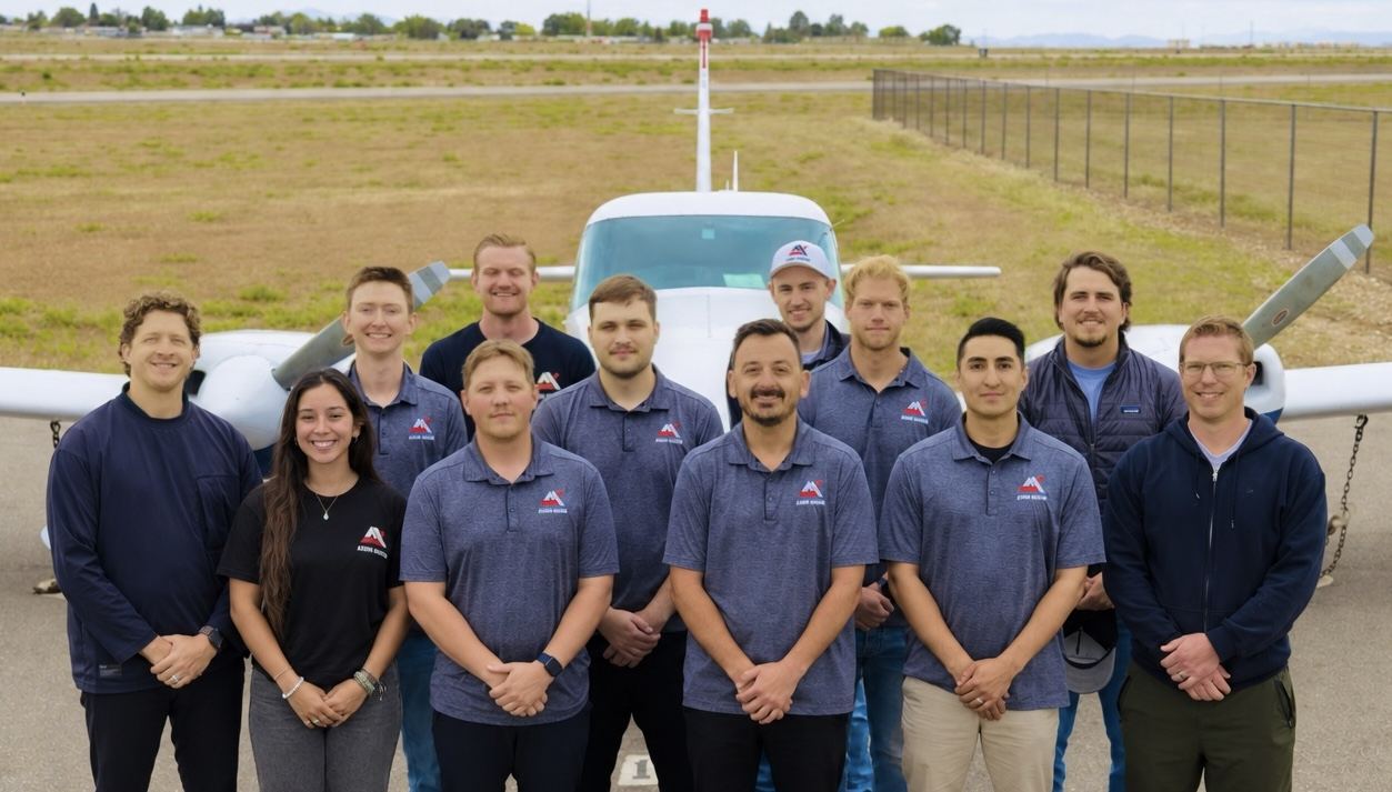 The Axiom Aviation Idaho Falls team standing in front of a training aircraft at KIDA