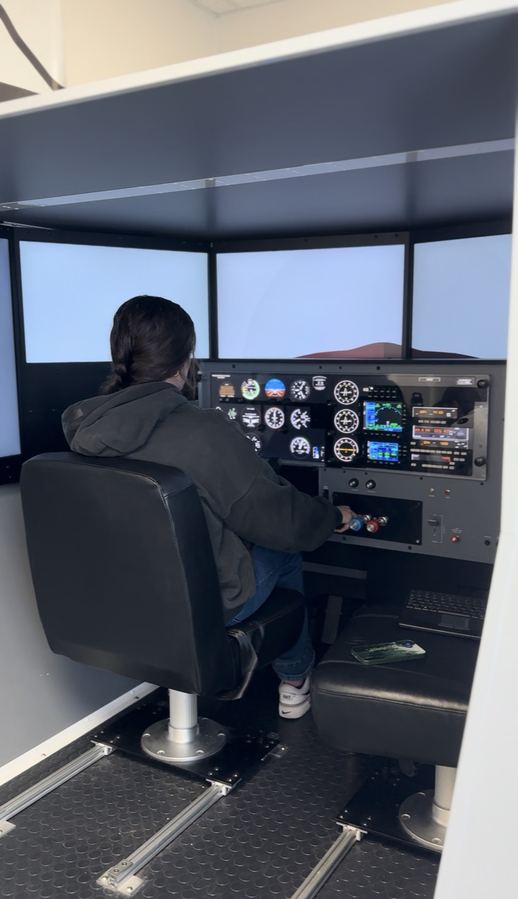 Pilot training at the controls of an Axiom Aviation simulator