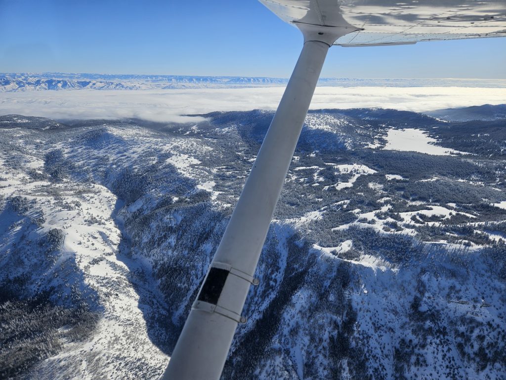 Aerial view of snow-covered Utah mountains from an Axiom Aviation training aircraft – Part 61 Flight Training