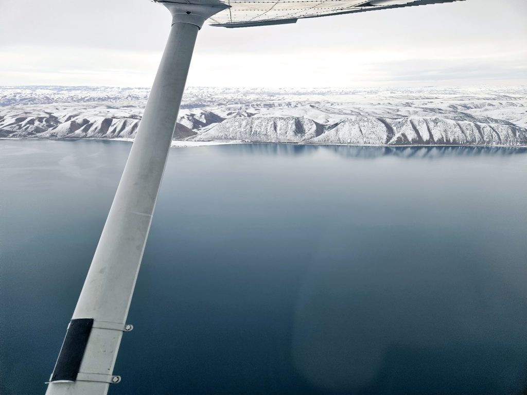 Aerial view of a lake during an Axiom Aviation training flight – How Much Do Airline Pilots Make? 2026 Pay Guide