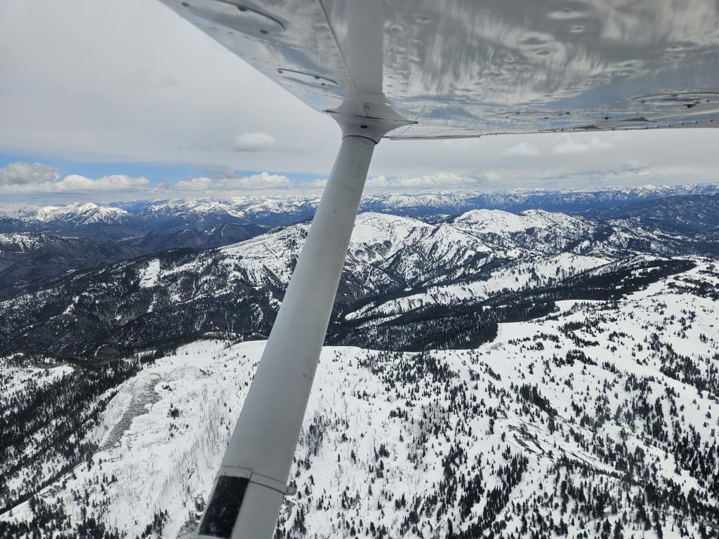 Aerial view of snow-covered Utah mountains from an Axiom Aviation training aircraft – How to Become a Pilot Without a Degree