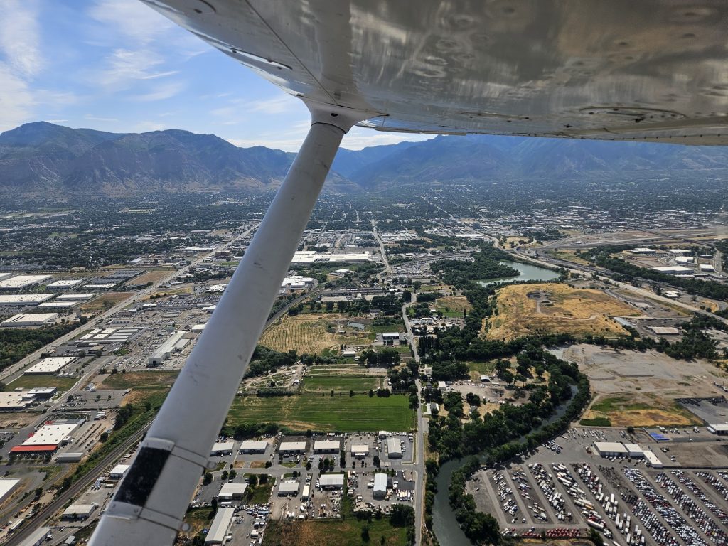 Aerial view of the valley below from an Axiom Aviation Cessna – Part 61 Flight Training