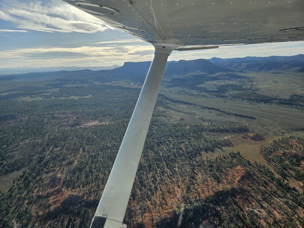 Aerial view of Utah mountains and canyons from an Axiom Aviation Cessna – How to Learn to Fly a Plane