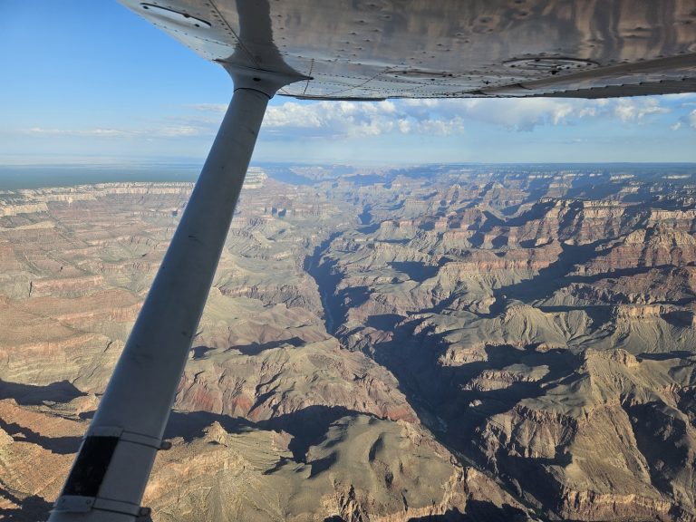 Aerial view of the Grand Canyon on an Axiom Aviation cross-country flight – How Much Do Pilots Make an Hour? Pay Guide