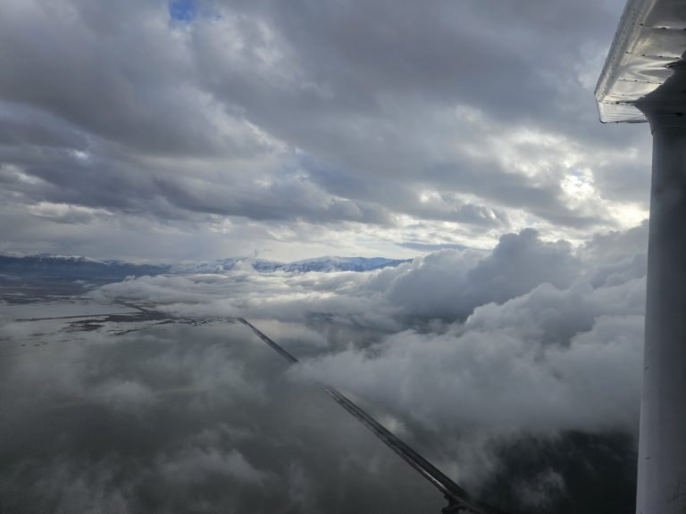 View above the clouds during an Axiom Aviation training flight – How to Avoid Spatial Disorientation in Flight Training