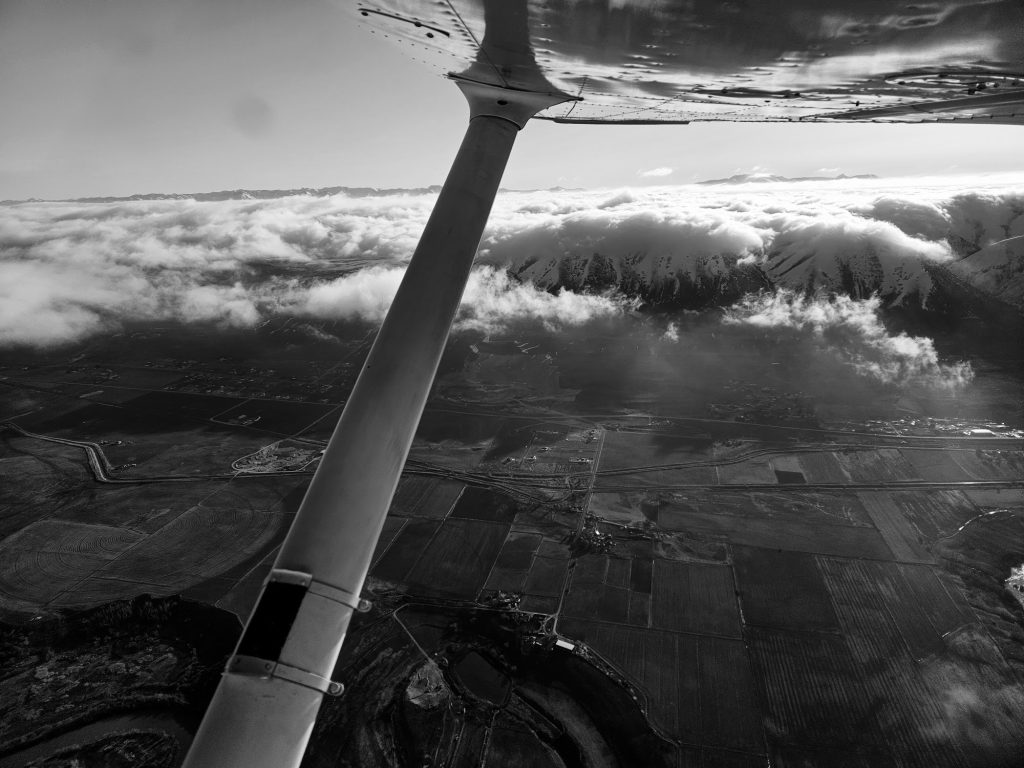 View above the clouds during an Axiom Aviation training flight – How Much Do Pilots Make an Hour? Pay Guide