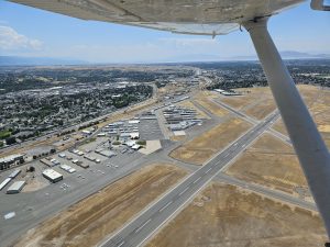 Aerial view of an airport runway during an Axiom Aviation flight – How to Get Hired by an Airline
