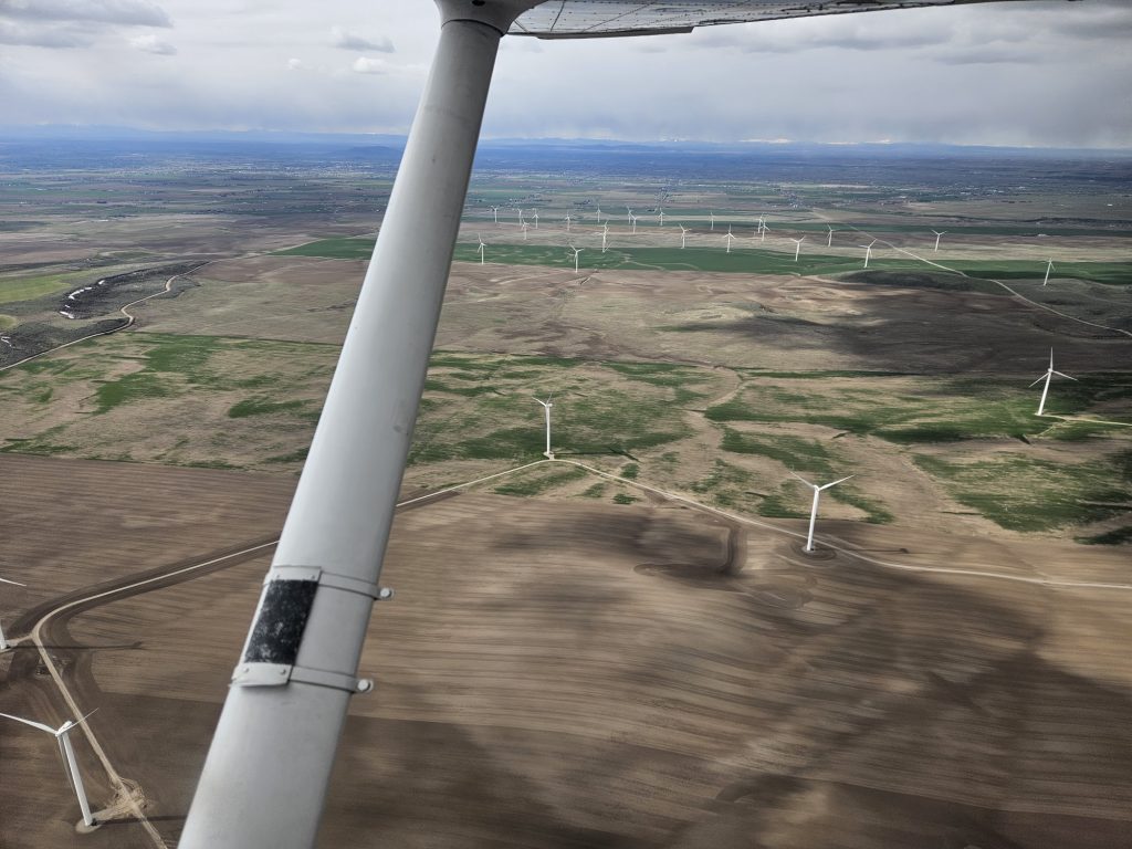 Aerial view of the valley below from an Axiom Aviation Cessna – How to Log Flight Hours Correctly