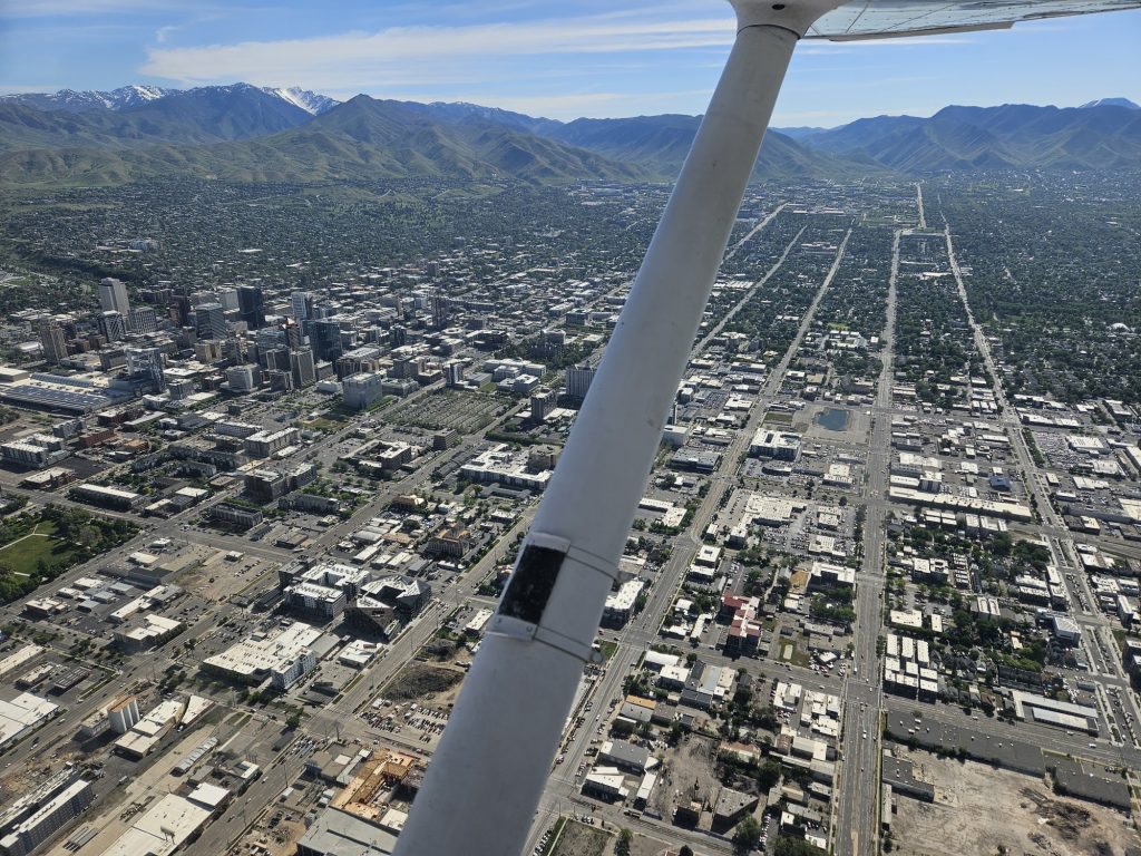 Aerial view of the valley below from an Axiom Aviation Cessna – 1500 Hour Rule Explained for Aspiring Pilots