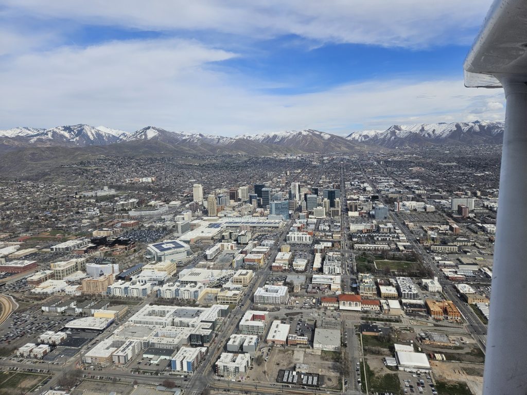 Aerial view of the valley below from an Axiom Aviation Cessna – 1500 Hour Rule Explained for Aspiring Pilots